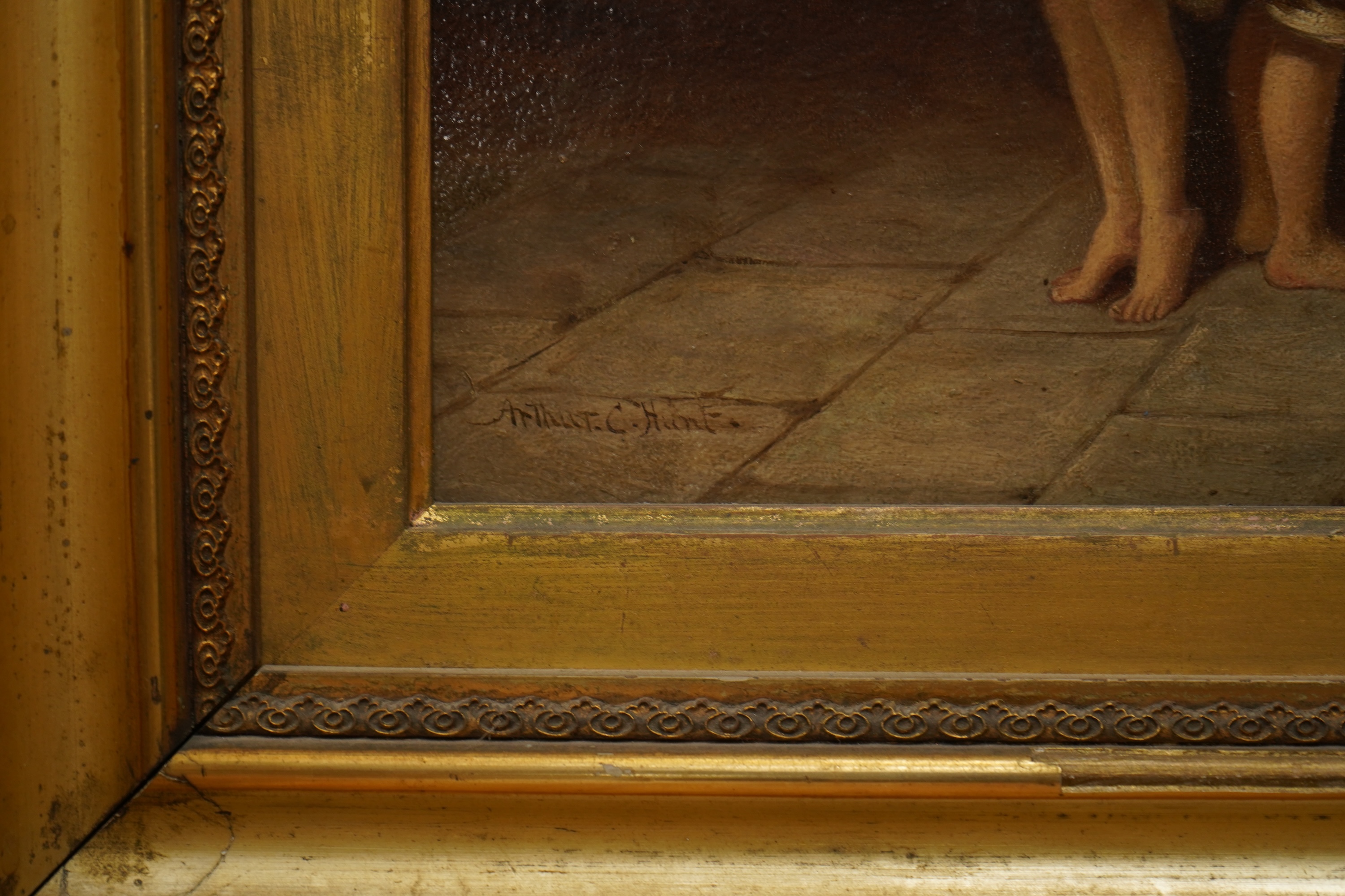Arthur C Hunt (fl.1863-1902), Children measuring their height, signed, oil on panel, 36 x 27cm, gilt framed